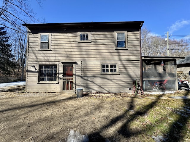 back of property featuring a sunroom