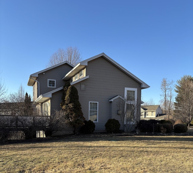 view of property exterior with a yard