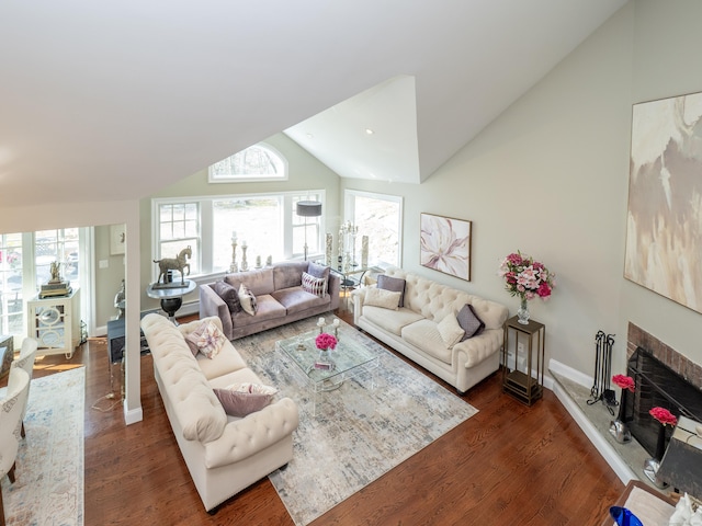 157 N Ave, Westport, CT 06880 - living room with a fireplace with raised hearth, baseboards, lofted ceiling, and wood finished floors