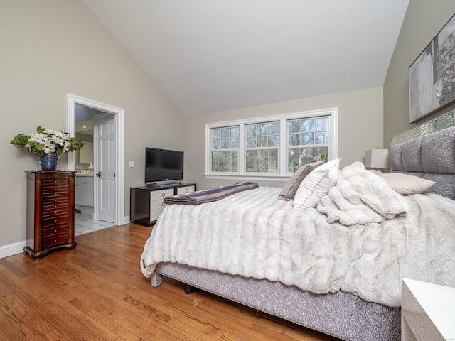 157 N Ave, Westport, CT 06880 - bedroom featuring baseboards, high vaulted ceiling, wood finished floors, and ensuite bathroom
