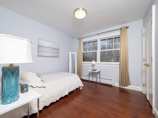 157 N Ave, Westport, CT 06880 - bedroom featuring a baseboard radiator, baseboards, and wood finished floors