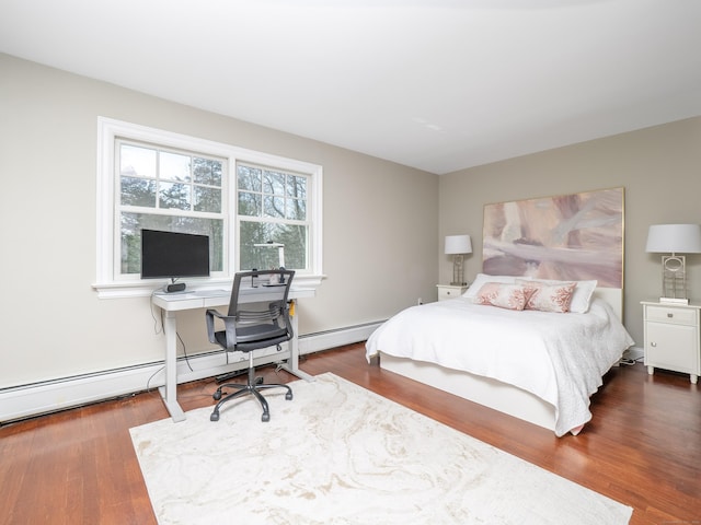 157 N Ave, Westport, CT 06880 - bedroom with a baseboard heating unit and wood finished floors