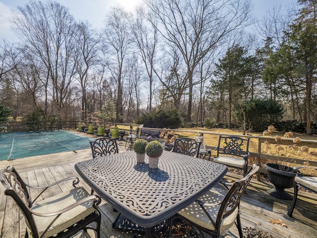 157 N Ave, Westport, CT 06880 - wooden terrace with outdoor dining area and a fenced in pool
