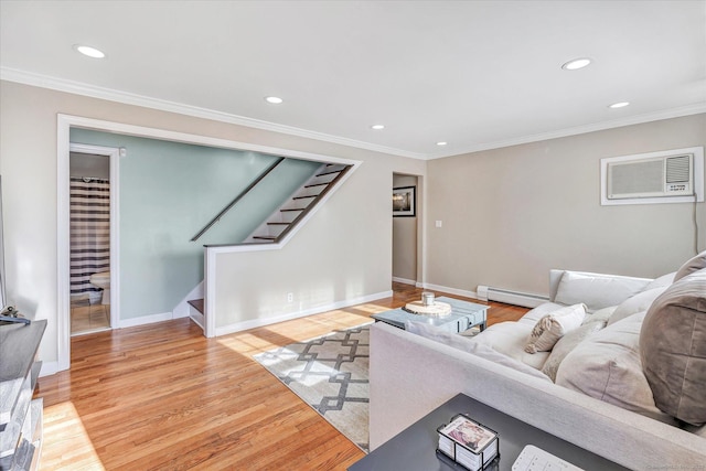 living area featuring stairway, wood finished floors, crown molding, a baseboard heating unit, and a wall mounted AC