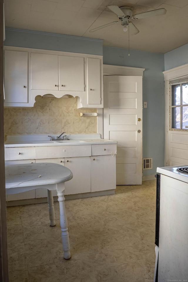 kitchen featuring ceiling fan, white cabinetry, light countertops, white range with electric stovetop, and light floors