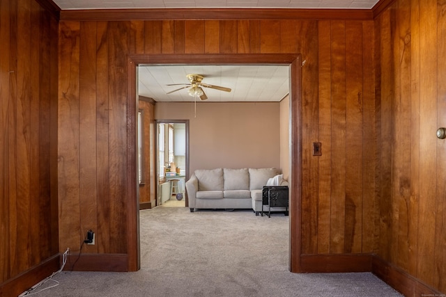 living room featuring carpet floors and wood walls