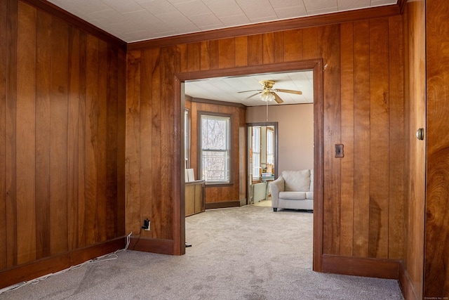 interior space featuring wood walls and ceiling fan