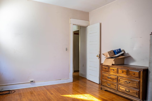 unfurnished bedroom with wood-type flooring