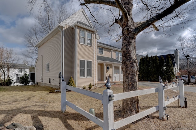 view of front facade with a fenced front yard