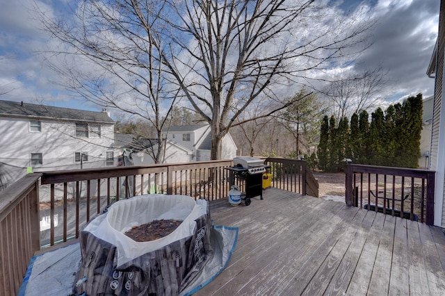 wooden deck with grilling area