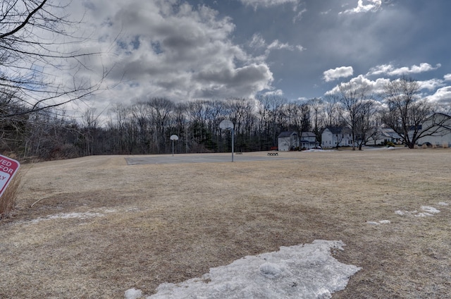 view of yard featuring community basketball court