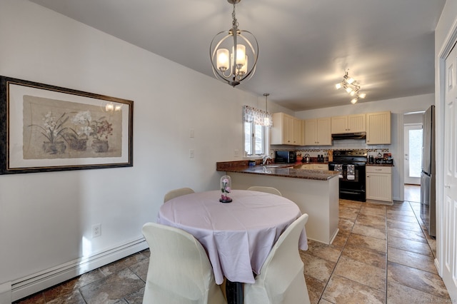 dining area with a baseboard radiator, a wealth of natural light, and a notable chandelier