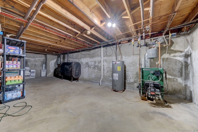 unfinished below grade area with water heater, a heating unit, electric panel, and heating fuel