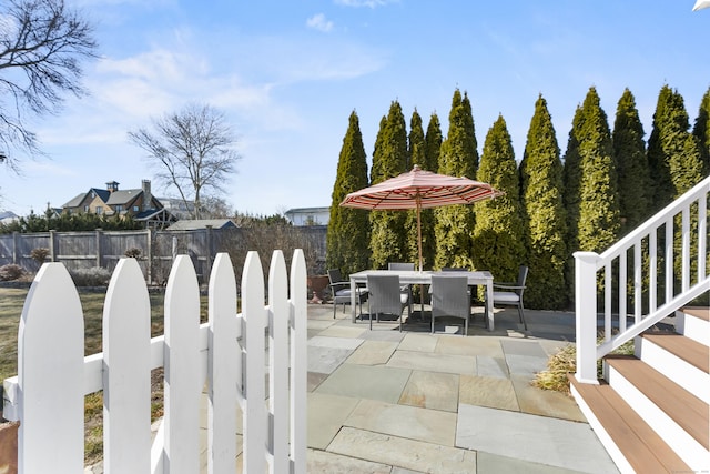 view of patio / terrace with outdoor dining space and fence