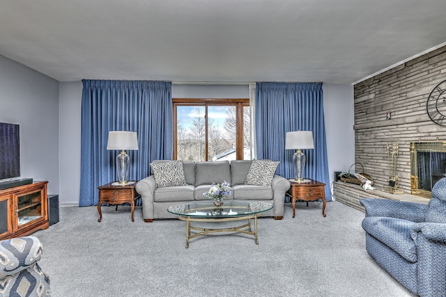 living room featuring a fireplace and carpet