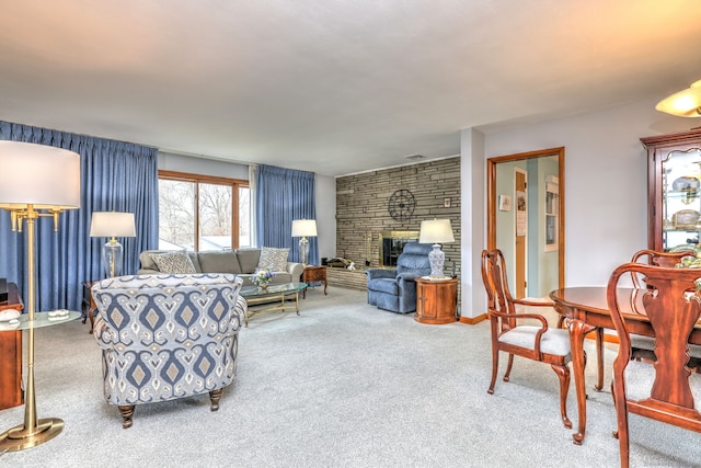 carpeted living area featuring visible vents and a fireplace