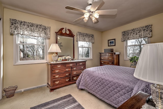 bedroom featuring baseboards, visible vents, carpet floors, and ceiling fan