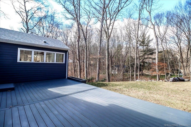 wooden deck with a lawn