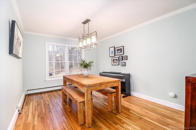 dining area featuring a baseboard heating unit, baseboards, ornamental molding, light wood-style flooring, and an inviting chandelier