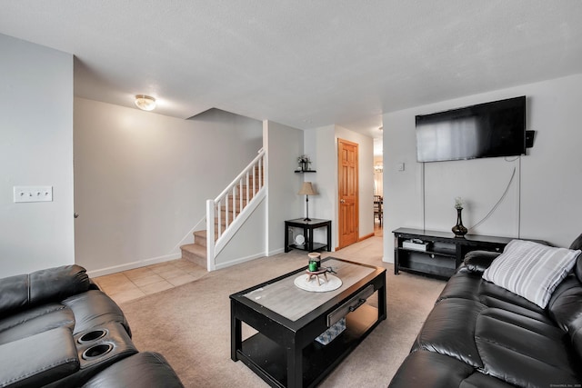 living area with stairway, light tile patterned floors, baseboards, and light carpet