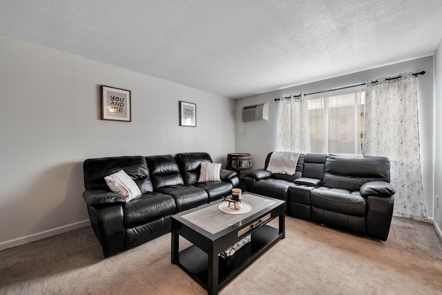 living area featuring a textured ceiling, an AC wall unit, baseboards, and light carpet