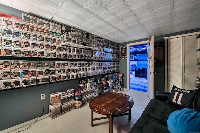 living area featuring baseboards