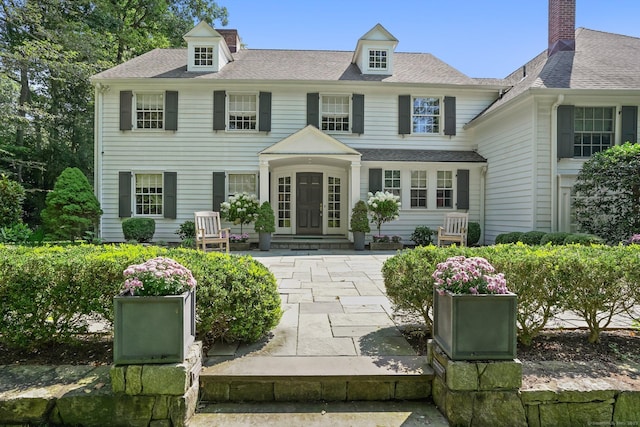 view of front of property with roof with shingles