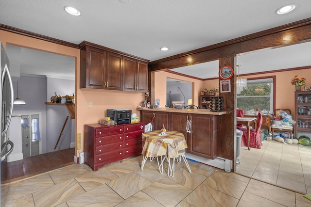 kitchen featuring crown molding and recessed lighting