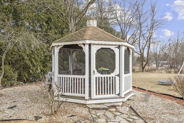 view of outbuilding featuring a trampoline and a gazebo