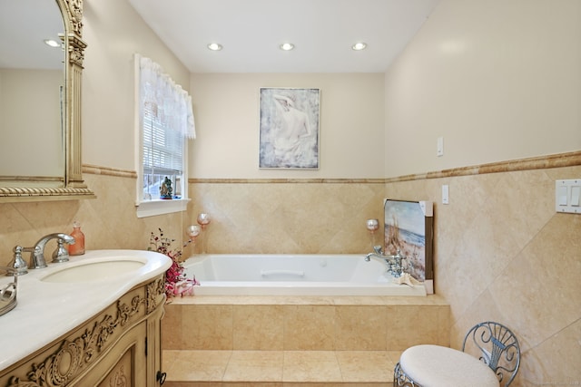 full bathroom with recessed lighting, vanity, tile walls, and a bath