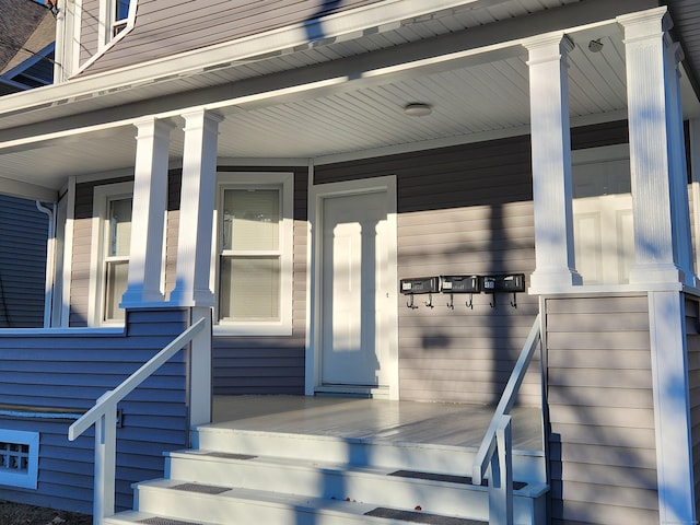 doorway to property featuring a porch