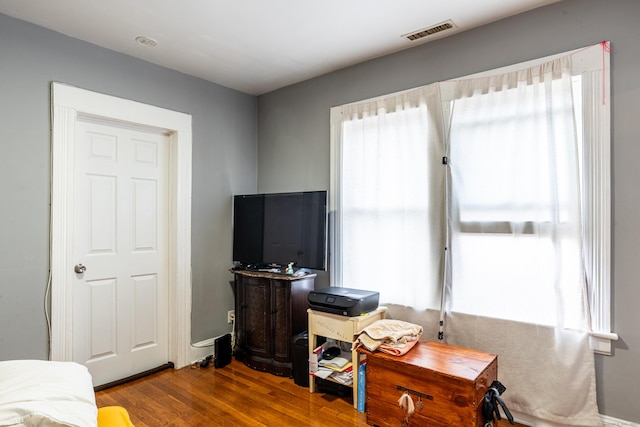 interior space featuring visible vents and wood finished floors