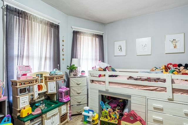 bedroom with wood finished floors