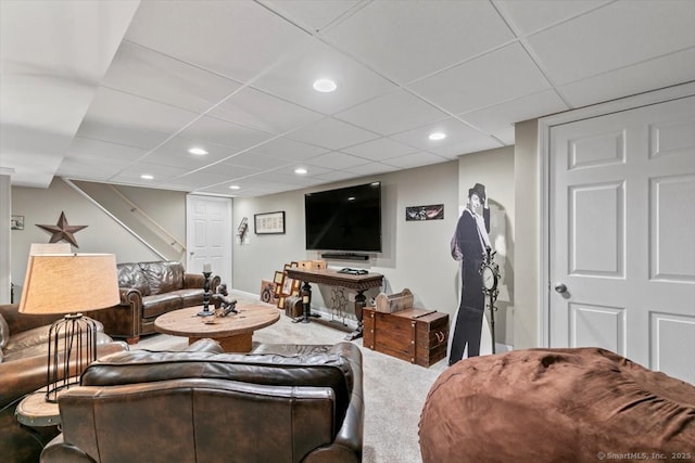 carpeted living area with baseboards and recessed lighting