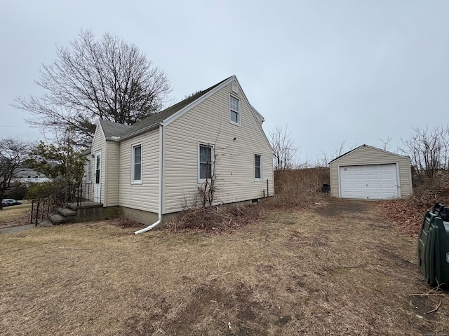 view of property exterior featuring a garage and an outdoor structure