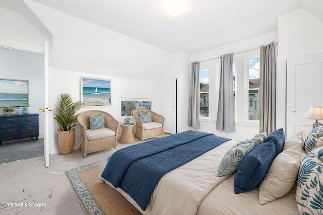 bedroom featuring lofted ceiling