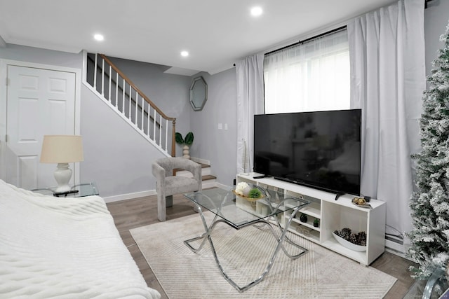 living room with stairs, baseboards, wood finished floors, and recessed lighting