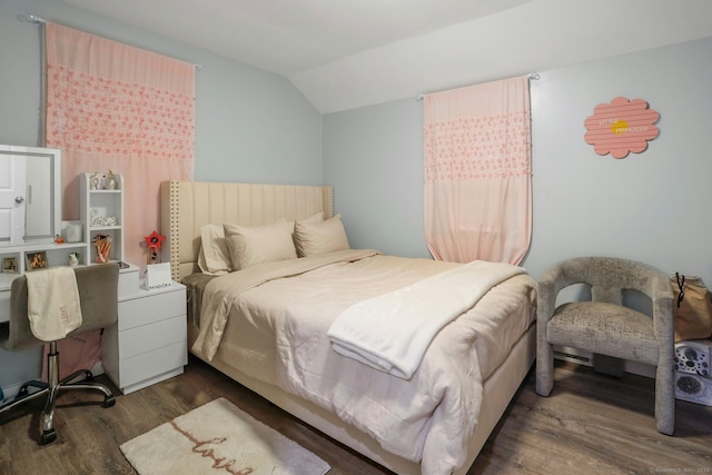 bedroom featuring vaulted ceiling and dark wood-type flooring