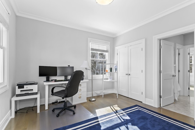 office area featuring ornamental molding, wood finished floors, and baseboards