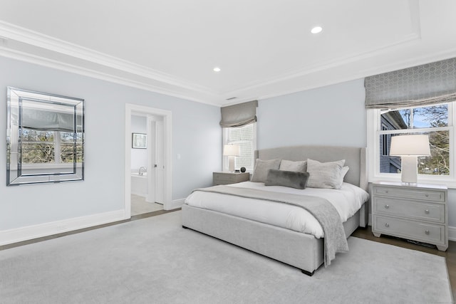 bedroom featuring crown molding, recessed lighting, ensuite bath, wood finished floors, and baseboards