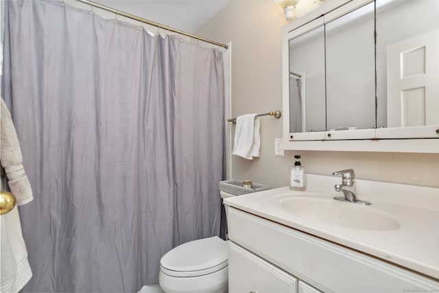 bathroom with a shower with shower curtain, toilet, and vanity