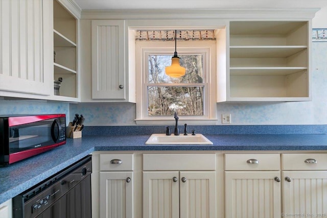 kitchen with dark countertops, open shelves, black dishwasher, and a sink