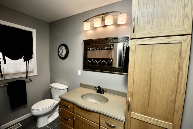 bathroom with tile patterned flooring, toilet, vanity, visible vents, and a shower with curtain