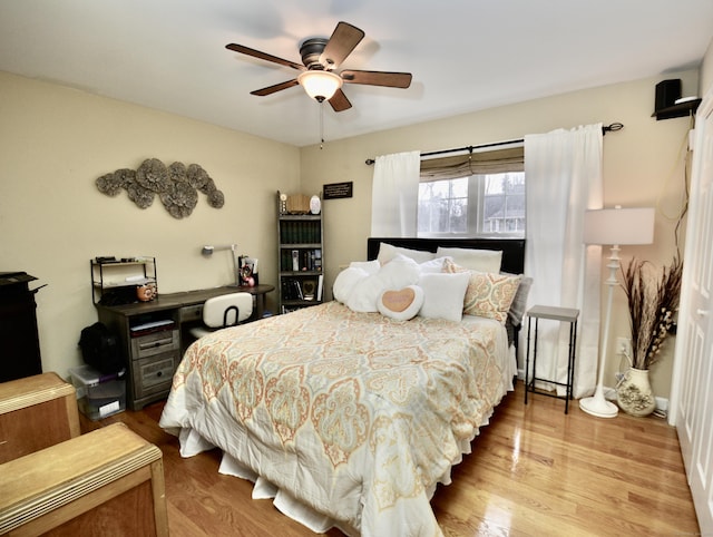 bedroom featuring ceiling fan and wood finished floors