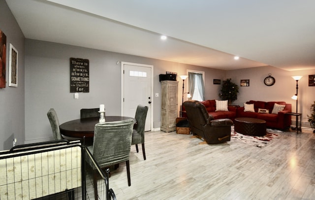 dining area with light wood-style floors, baseboards, and recessed lighting