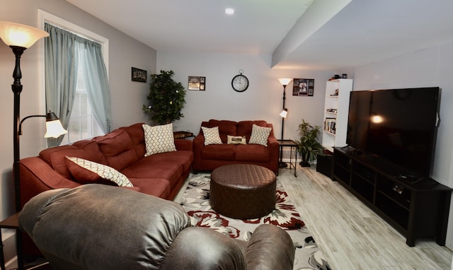 living area featuring light wood-type flooring and recessed lighting