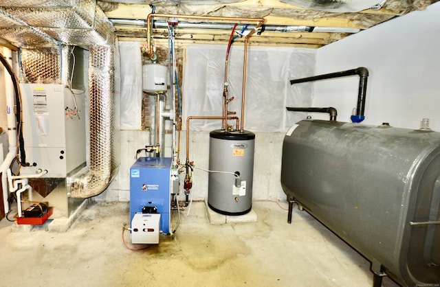 utility room featuring water heater, a heating unit, heating unit, and heating fuel