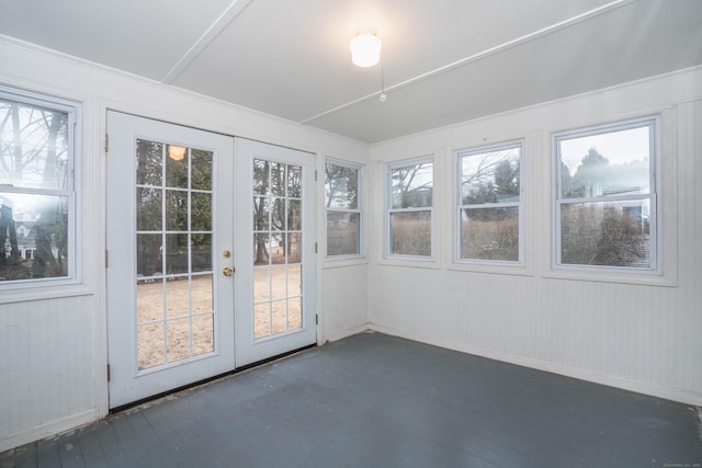 unfurnished sunroom with french doors