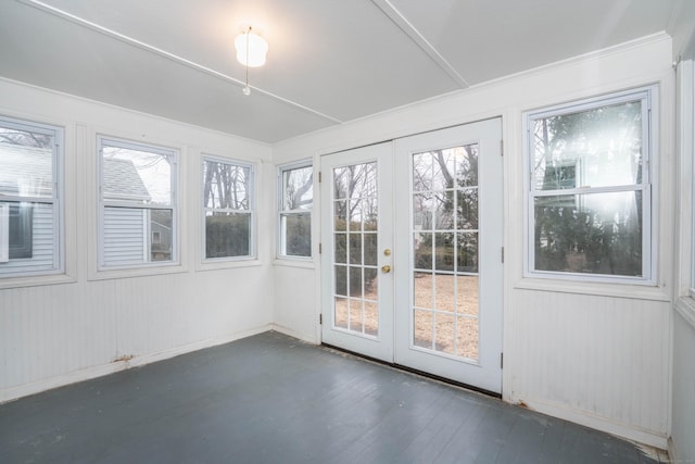 unfurnished sunroom featuring french doors