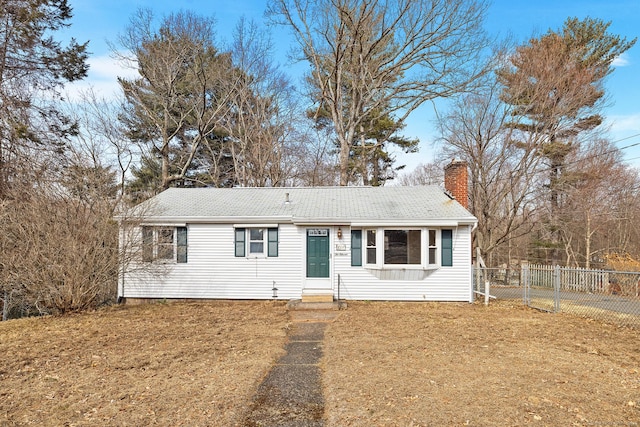 single story home with entry steps, fence, and a chimney